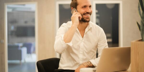 man using smartphone on chair